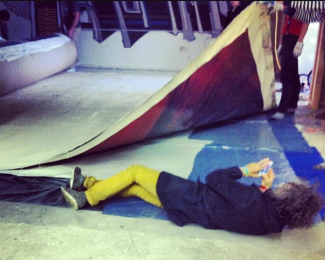 Wayne Coyne photographing the giant Damien Hirst spin art painting before it was installed on the Delo Creative ceiling (photo by Mary Beth Babcock)
