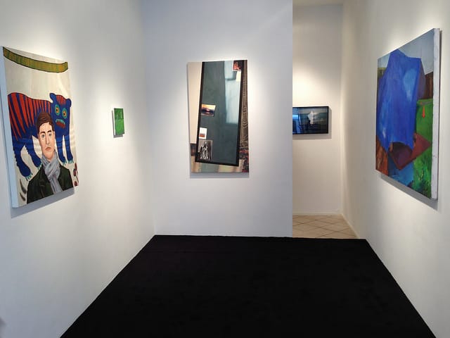 View of Storefront's "fiction/non-fiction" show with Holly Coulis' "Tiger Death" (2012) on left and Michelle Hailey's "From the West" (2013).