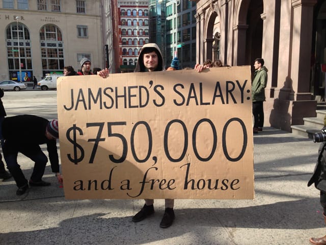 A student holds a sign stating Cooper Union President Jamshed Bharucha's salary at today's rally.