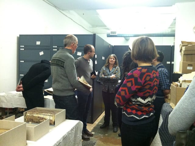Ann-Marie Reilly, the American Folk Art Museum's chief registrar and director of exhibition production, talks to the group.
