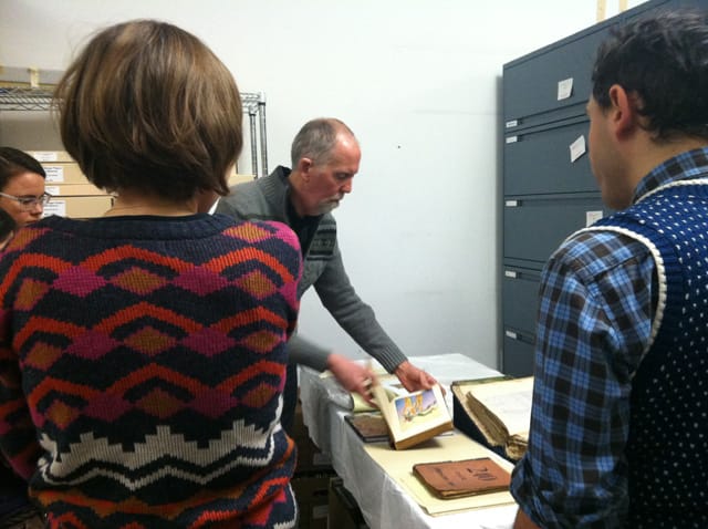 Kevin Miller showing us a page in one of the "Oz" books, which influenced Darger.