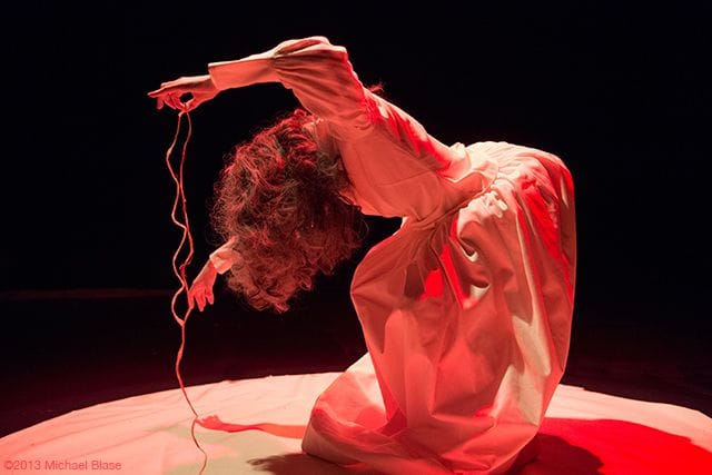 Vangeline in the beginning of her performance. Note her rigid body movement. Photo by Michael Blase.