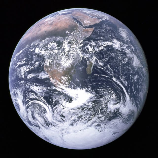 View of the Earth as seen by the Apollo 17 crew traveling toward the moon (image via Wikipedia)