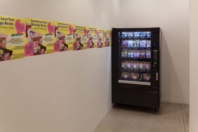 Temitayo Ogunbiyi, "Lovely Love Text Message Books" (2012), limited-edition books, vending machine, and currency; books: each 7 3/4 x 5 1/4 in; overall: 72 x 40 x 35 1/2 in (courtesy  and © 2012 Temitayo Ogunbiyi)
