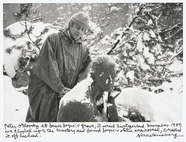 Allen Ginsberg, "Peter Orlovsky at James Joyce’s grave, Zurich Switzerland December 1980, we climbed up the cemetery and found Joyce’s statue snowcovered, brushed it off his head." (1980), gelatin silver print, printed 1984–97￼￼￼￼￼, 7 1/2 x 11 1/4 in. Collection of Gary S. Davis (© 2012 Allen Ginsberg LLC, all rights reserved)