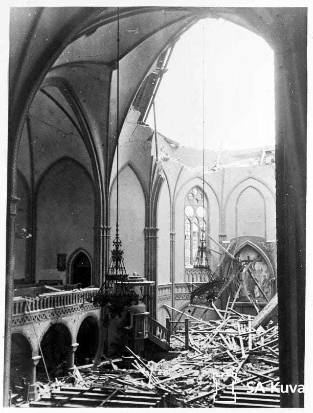 A church with a bombed out roof.