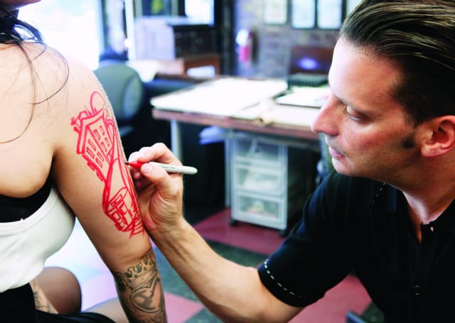 Kaves sketching a tattoo