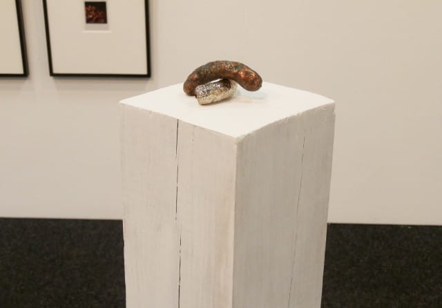 Lisa Kirk, "Sworn to Secrecy: Canoodle Cheese Doodle" (2013), copper and nickle plated Cheetos