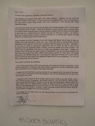 Bowers's letter hangs alongside all of her works at the fair. (Click to enlarge) (Photo by the author for Hyperallergic)