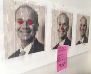 A poster in the Foundation Building lobby on Friday evening of Cooper Union president Jamshed Bharucha with clown accents.