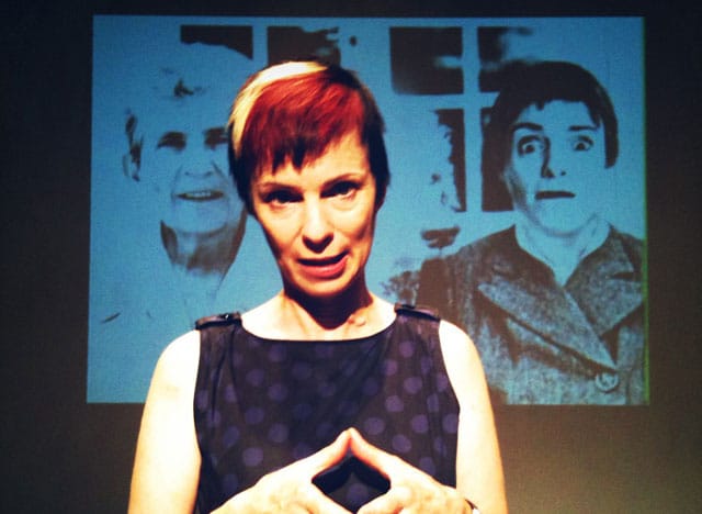 Holly Hughes in her 2010 performance of, Dog and Pony Show, at Dixon Place, NYC. (Source)