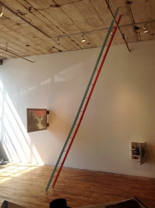 Matt Freedman, "The Devil Tricked Me" (2013). Installation view: left, "Red Sky in Morning, Sailor’s Warning" (2013), paper and plastic and paint and misc., 24 x 36 x 2 inches; center, "Leaning Ladder" (2013), wood and paint, 12 x 169 x 1 inches; right, "Broken Mirror Vanity" (2013), found object. 14 x 20 x 4 inches. Click to enlarge.