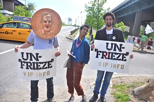 Members of Occupy Museums, including Imani Brown (center) and Noah Fischer (right) (photograph by Geraldine Visco for Hyperallergic)
