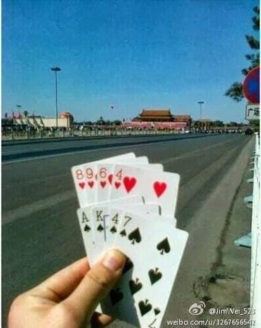 AK47 cards in Tiananmen Square (Via the Encyclopedia of Virtual Communities in HK)
