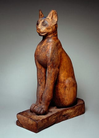 Figure of a Cat, Provenance unknown, Ptolemaic Period Roman Period (305 BCE–1st century CE), wood, gilded gesso, bronze, rock crystal, glass, 25 9/16 x 6 5/16 x 11 13/16 in (65 x 16 x 30 cm) (collection and courtesy of Brooklyn Museum) (click to enlarge)