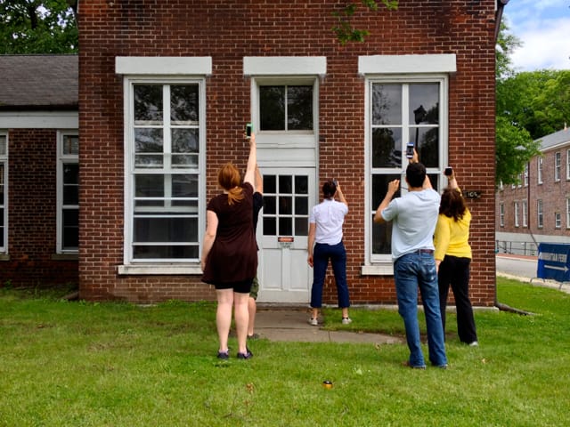 In "Fidgital Spring," members of Hook and Eye Theater Company used their Facebook newsfeeds as performative guides during Fingment NYC on Governors Island.