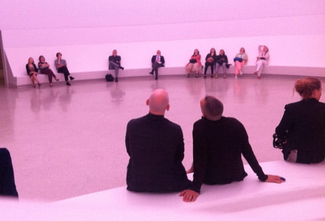 Purple-tinted viewers take in "Aten Reign" in the Guggenheim's lobby (photo by the author for Hyperallergic)