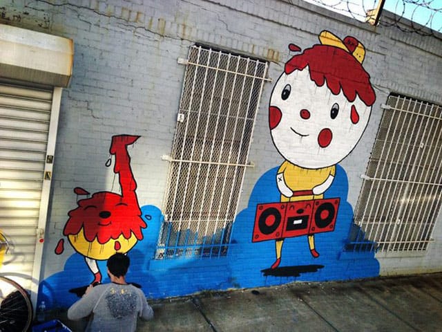 Adrian Sonni working on his Bushwick Collective mural