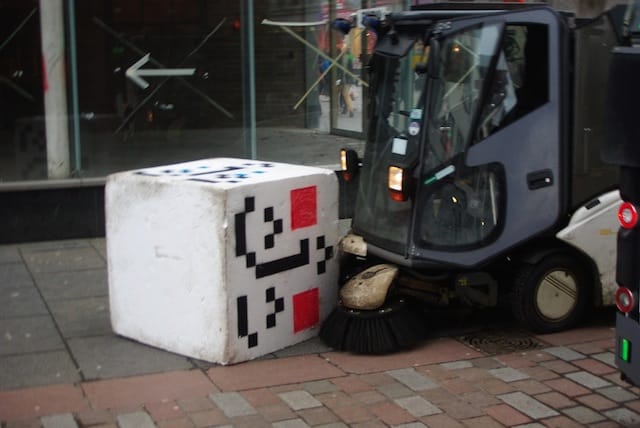 Peter Drew's "Pixel Face" interactive cube getting street-swept in Glasgow (image via the artist)