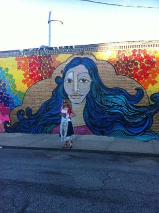 Olek in front of the Welling Court collaboration between  her and Alice Mizrachi