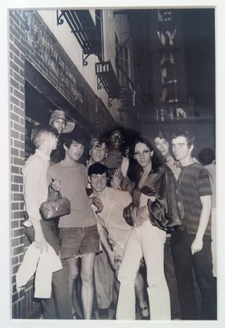 Fred W. McDarrah's "Celebration After Riots Outside Stonewall Inn" (1969) is also on view in the show. Lanigan-Schmidt is on the far right. (click to enlarge)