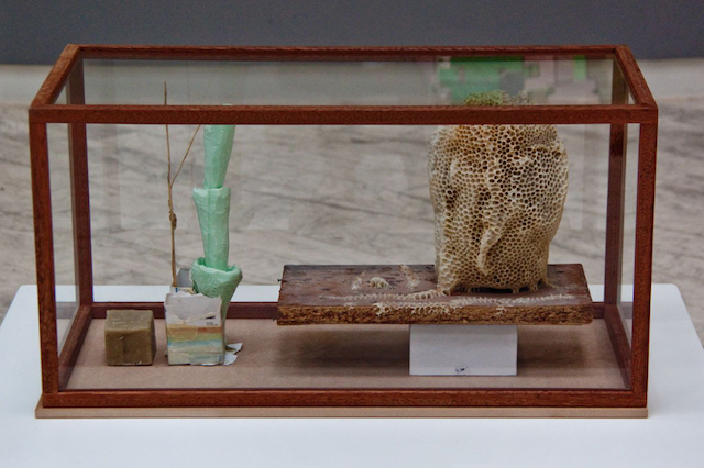 Emil Westman Hertz, "The New Face," glass display cabinet with beeswax, pollen, dust, polystyrene, 71 x 36 x 36 cm, (2013)