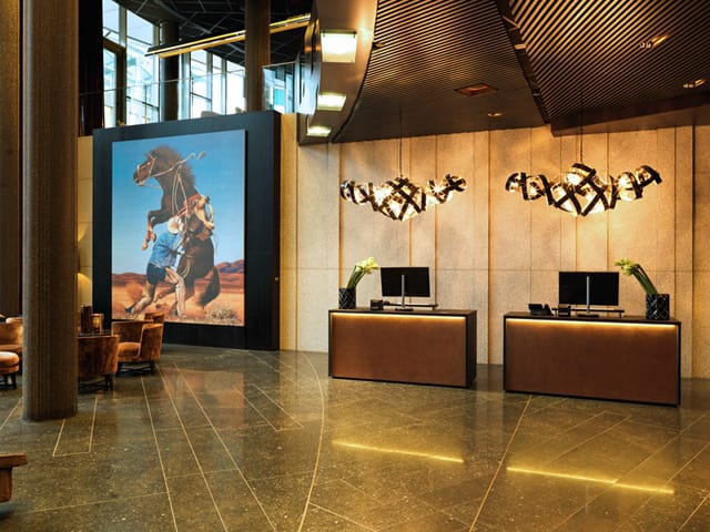 A Richard Prince cowboy photograph hangs in the lobby of The Thief hotel in Oslo. (via pocketoslo.com)