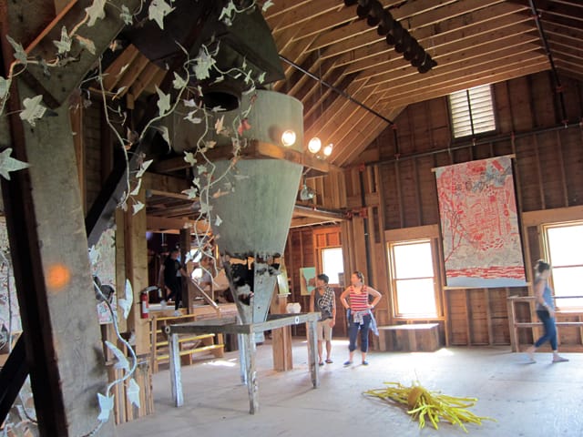 Giada Crispiels, "Climbing Ivy, Wassaic" (2013), newspapers, masking tape, iron wire; Tora Lopez, "Two Cheers for the Bundle of Sticks Metaphor" (2012), found wood from Wassaic, tinted beeswax, tinted twine