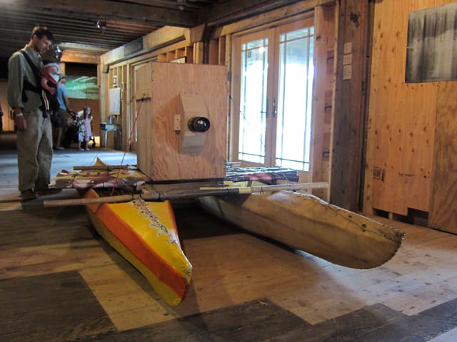 Ben Ripley, "Traveling Camera (river journey)", mixed media. boat camera load with 200 square feet of film and floated down the rier. images on the wall. 