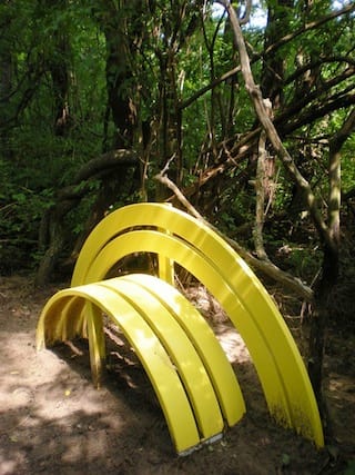 Bench Around the Lake is a public artwork by Danish artist Jeppe Hein http://www.flickr.com/photos/sarahvain/4728000542/sizes/z/in/photolist-8cNeQJ-7JoDz4-7KxqoC-7KtuiD-7KxqhQ-7Kxqrh-7KxqwS-7KwVrd-7KxqtG-7Jxhvc-7JruNt-7Jvtvm-7JvtCA-7Jpqb9-7Jpq57-7Jkuta-7KFYin-7KFZ3K-8cJVXt-8S2UBA-8RYPmk-8RYPji-8RYPon-8S2Ux1-8RAb5p-8RAbkp-7PUjD9-7PUjBo-7JvtxW-7JrxTF-8cNeVQ-8cNeKo-8cJV8n-8cJVbc/