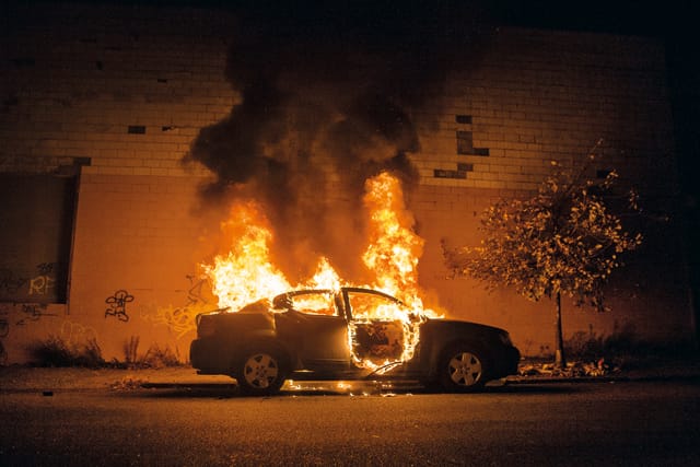 Burning car outside of Tod Seelie’s apartment, Bushwick, 2007