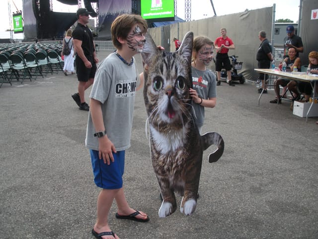 Posing with life-size Lil Bub