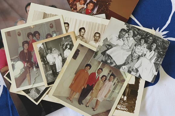 Lapiz family photos waiting to be digitized. | Photo: Catherine Trujillo, from the family album of Arcadia Lapiz. Courtesy of The Re/Collecting Project. California Polytechnic State University, San Luis Obispo. (http://reco.calpoly.edu)