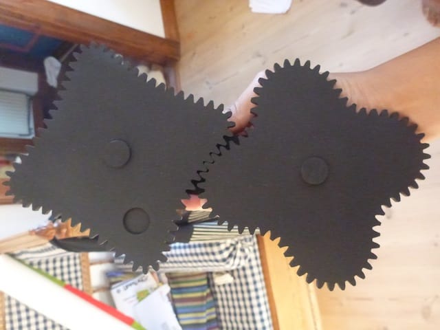 St. George demos his non-circular gears, which help operate the installation. Photo by the author.