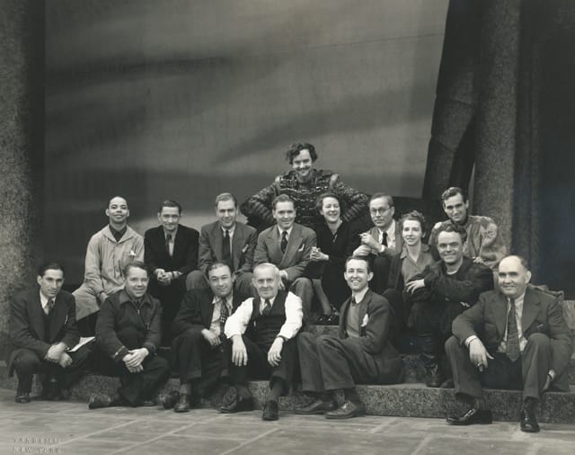 Stage crew portrait for Macbeth, 1941, including Maurice Evans (in costume), Perry Watkins (far left), director Margaret Webster, Tommy Vandamm, and lighting designer Jean Rosenthal. Credit: The New York Public Library for the Performing Arts, Vandamm Theatrical Photograph Collection, Billy Rose Theatre Division