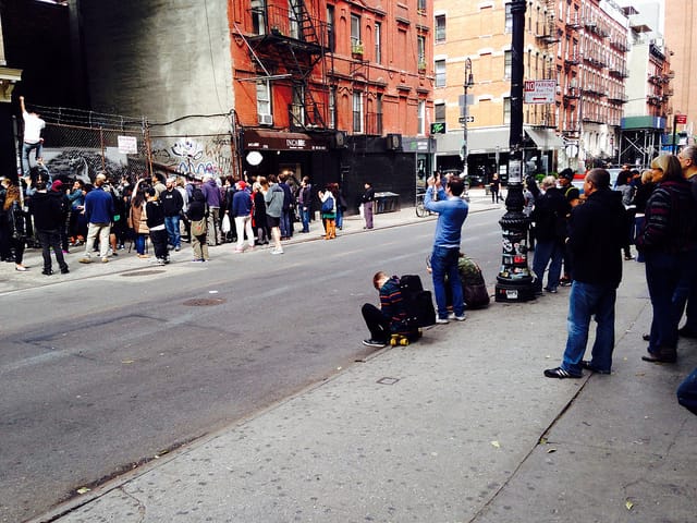 A view of the crowd around the new LES Banksy today around noon.
