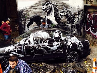 Trespassers crawling around the Banksy. (click to enlarge)