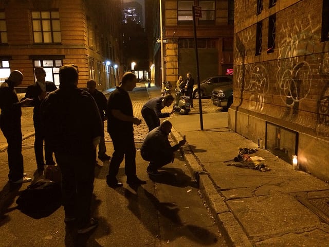 People visiting the Tribeca Banksy late last night at approximately 11:30pm EDT (All photos by the author for Hyperallergic)