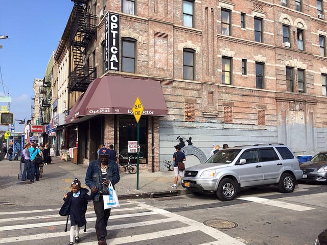 A view of the Banksy at the corner of Graham Avenue and Cook Street (all photos by the author for Hyperallergic)