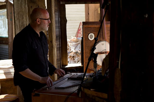 Playing one of the sound strucutres at "The Music Box" (photograph by Michelle Ettlin/Flickr user)