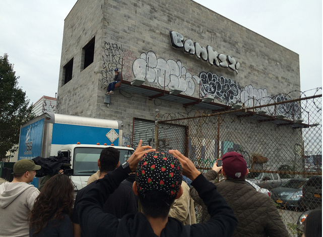 One of the potential thieves on the billboard ledge.