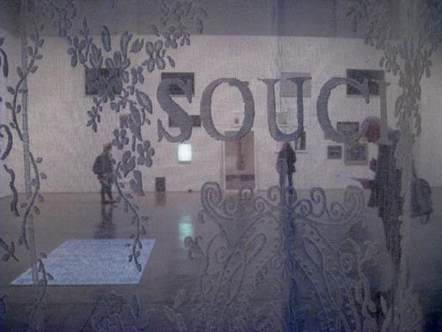 "Souci" (2012), embroidered lace curtains