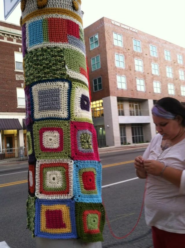 Amber of  Collective Wings installing Division Fibers Yarn Bomb project at ArtPrize 2013. All images courtesy of Collective Wings and Amber TK