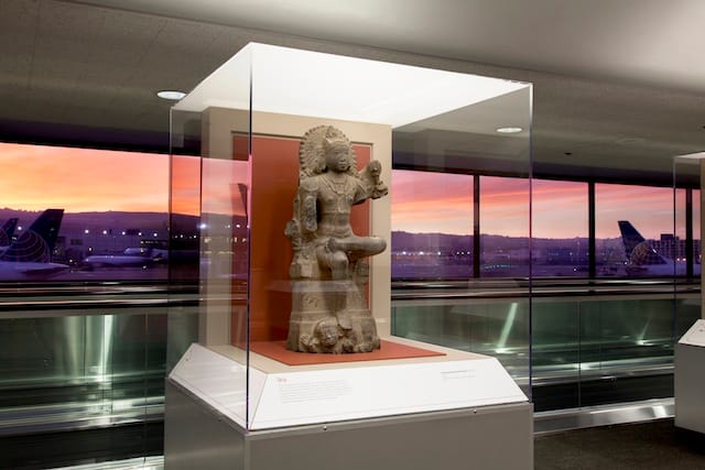 The Hindu Deity Shiva as a divine teacher, a granite sculpture lent by the Asian Art Museum for Deities in Stone: Hindu Sculpture from the Collections of the Asian Art Museum. Image courtesy SFO Museum.