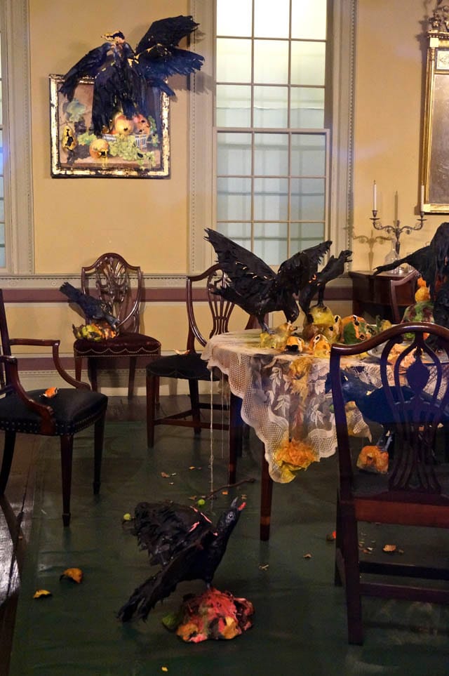 Details of Valerie Hegarty's "Tablecloth with Fruit and Crows" (2013) and "Still-Life Paintings with Crows" (2013), in the Cane Acres Plantation dining room