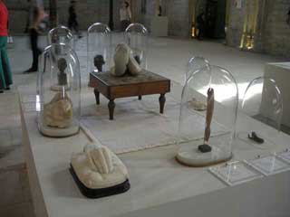 Vitrines filled with relics and work by the artists (click to enlarge)