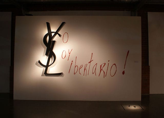 Artemio, "YSL" (2012), aluminum and lipstick on wall 