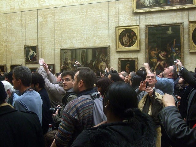 Clamoring crowds around the Mona Lisa (photo by Harald Groven, via Flickr)
