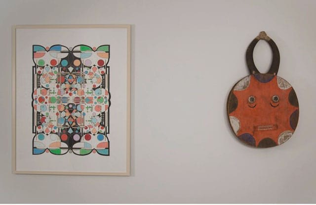 Glendalys Medina's “Alphabet Series: #8 of 26 (H)” (2012) alongside a Goli Mask from the Ivory Coast (early 20th century) (photo courtesy Coworker Projects)