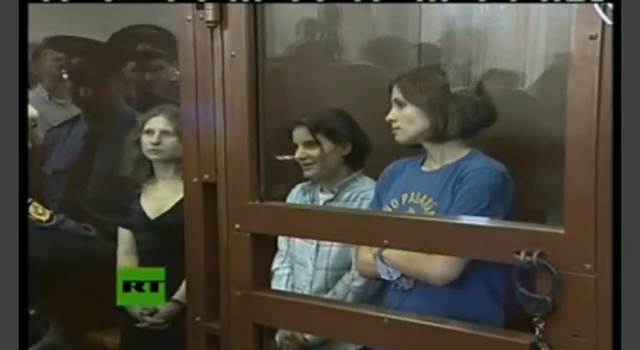 Pussy Riot members Nadezhda Tolokonnikova, Yekaterina Samutsevich, and Maria Alyokhina at the verdict of their trial (screenshot via YouTube)